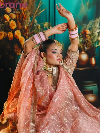 An elegant Eid-inspired look with a soft pink color palette, showcasing skills in creating festive and culturally specific makeup.
