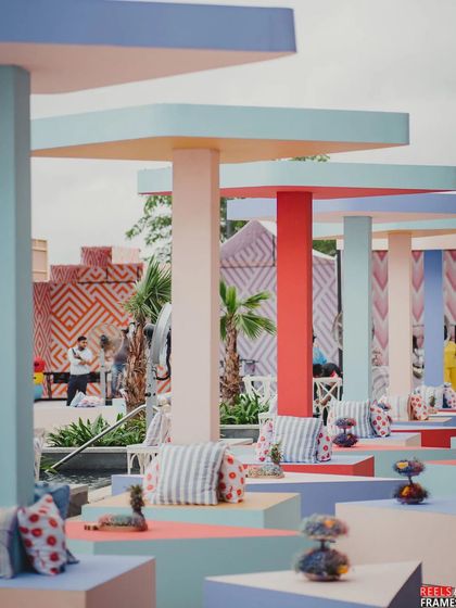 Another view of the pastel geometric brunch, showing the interactive activity zones in the background, which were also designed with different geometric patterns and happy colors.