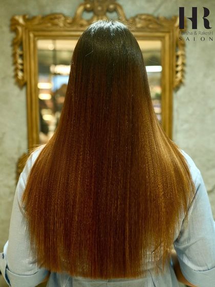 A unique take on styling after a smoothing treatment, with crimped ends adding texture to the otherwise sleek hair.