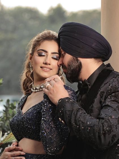 A tender moment between the couple, her jewellery adding to the romantic feel.