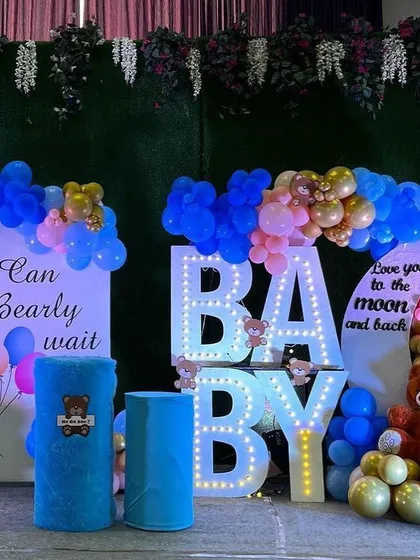 This gender reveal setup uses the teddy bear theme with a fun twist. We combined blue and pink balloons with large, light-up "BABY" letters and multiple teddy bear details to build excitement for the big announcement.
