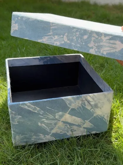 Another shot of the open indigo box, ready to be filled with gifts or personal items. It's a sustainable and stylish storage solution.