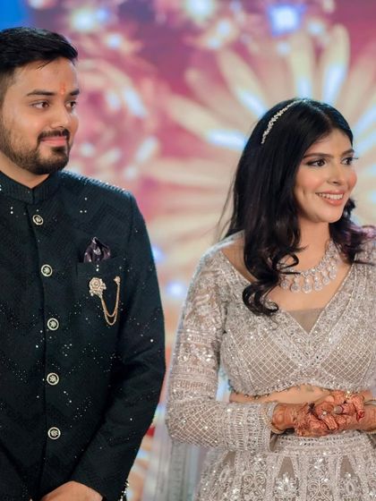 A candid moment of the couple, smiling and enjoying their Sangeet.