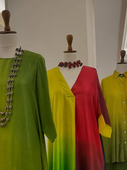 A stunning display of ombre tunics by Meghna Panchmatia. The gradual shift in colors from green to yellow to red creates a beautiful, artistic effect.