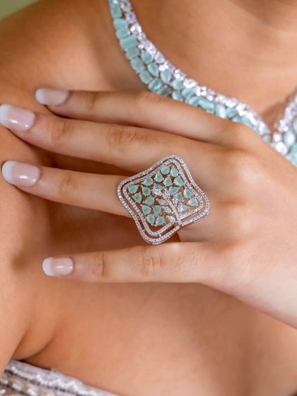 The unique tree-of-life-inspired ring from our mint green American diamond collection. This artistic piece is a conversation starter, perfect for someone with a unique sense of style.