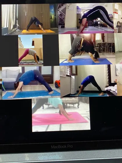 I love this view of everyone practicing Adho Mukha Svanasana, or Downward Dog, together. There is a special energy when we all move and breathe as a community, even when we are miles apart. It builds a feeling of harmony and togetherness.
