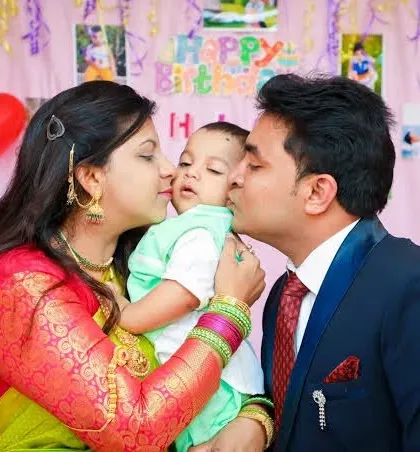 A beautiful, candid moment of parents kissing their baby. I aim to capture the love and affection within the family.