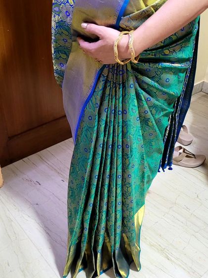 A close-up of the pleats for a client's baby shower function. The drape is neat and secure, designed to be comfortable for a mom-to-be.