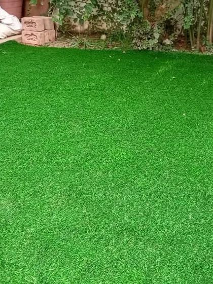 A lush, green artificial lawn that looks and feels like the real thing, but requires none of the upkeep.