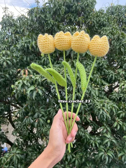 A handful of cheerful yellow tulip stems.