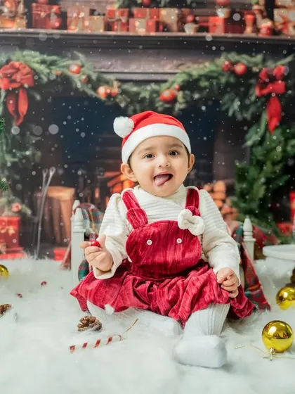 Another fun, tongue-out expression that perfectly captures the playful spirit of a toddler during the holidays.
