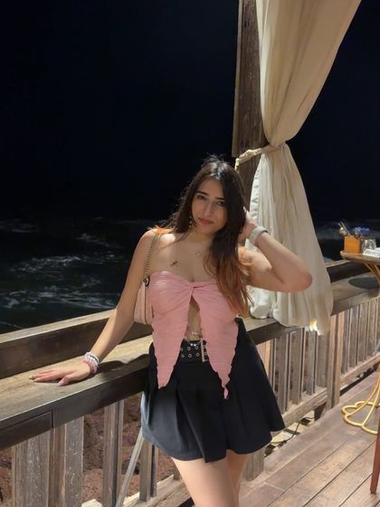 A smiling shot on the oceanfront balcony. This captures a happy and relaxed vacation moment.