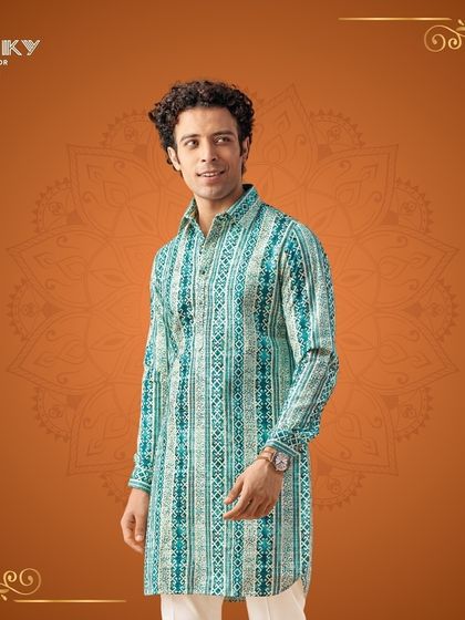 This printed kurta in shades of teal is another excellent choice for festive celebrations, offering a look that is both vibrant and sophisticated.