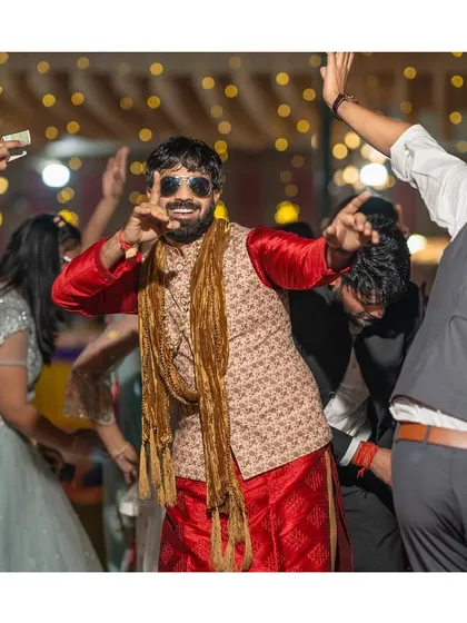 The dance floor is my film set for capturing the real energy of the wedding. This groom owned the night with his killer moves, and I was right there to get the shot. This is the 'dhamal' I promise to capture.