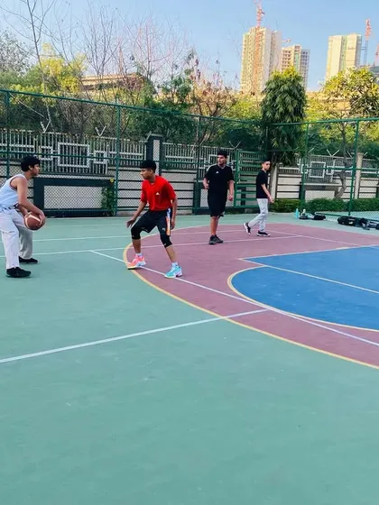 A player practices his one-on-one moves against a defender.
