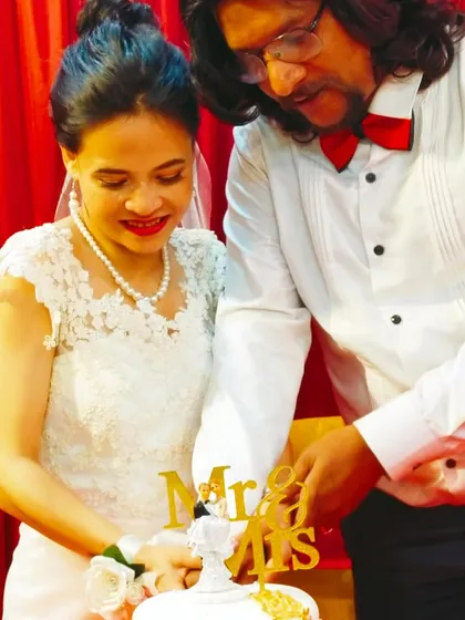 It is an honor to be part of such a happy day. Here is the lovely couple cutting their custom two-tier wedding cake, a moment that makes all the detailed work worthwhile.