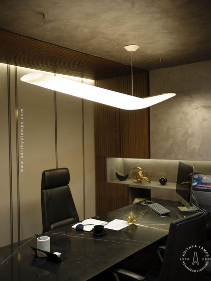 A duplicate of image 118, showing the pendant light in the context of a fully designed executive office, adding a touch of modern artistry.