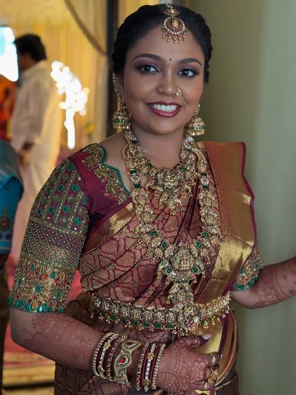 A happy, candid shot of Prithivi. Her smile shows her confidence and joy, and the makeup looks fresh and vibrant even in a non-professional, in-the-moment photo.