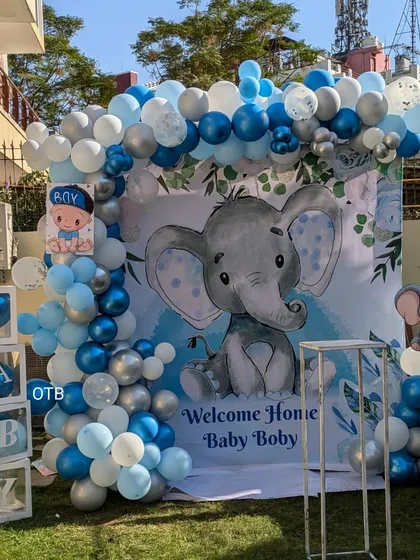 Welcoming a baby boy with this adorable elephant theme setup in the family's garden. I created a full photo corner with a custom backdrop, a blue and silver balloon arch, and cute "BABY" boxes for the perfect welcome home pictures.
