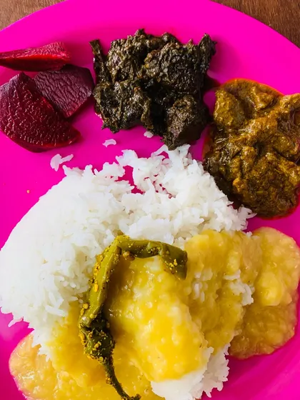 A full view of my plate, with dal and a whole king chilli on top of the rice, served with my homemade beef liver and smoked pork curries.
