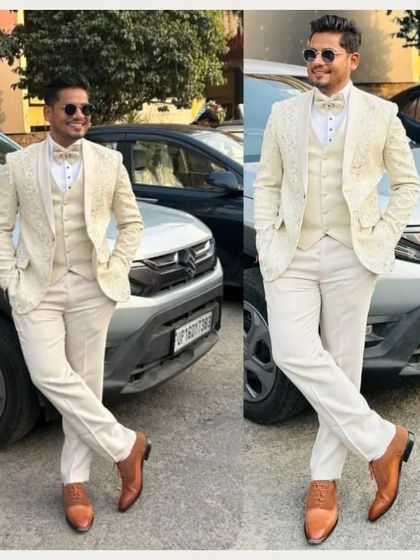 Our client looking effortlessly cool and stylish in a custom white three-piece tuxedo. This is a fantastic look for a day wedding or a summer reception.