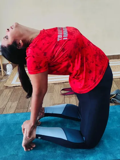 An amazing backbend by a student in Ustrasana (Camel Pose). This deep variation shows incredible spinal flexibility and openness in the chest and shoulders.