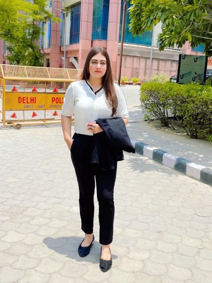 A moment of composure outside the court, ready for the proceedings ahead.