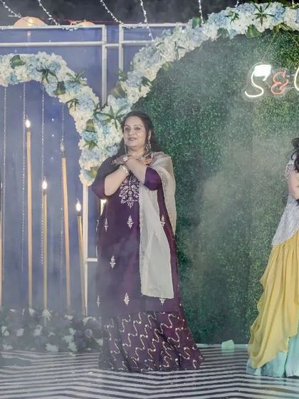 The ladies' group performance surrounded by smoke, creating a dreamy and dramatic effect on stage.