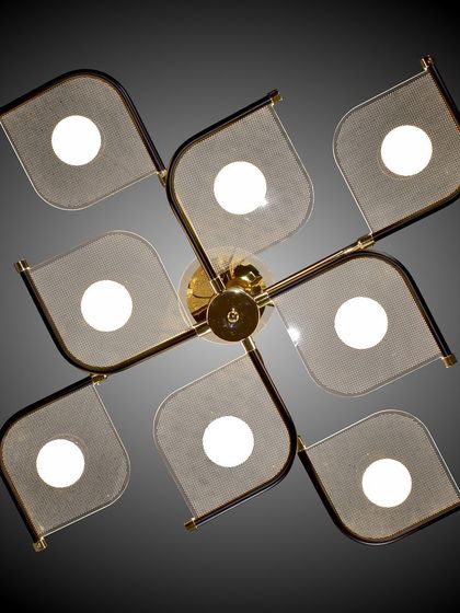 A top-down view of the modern leaf-panel chandelier, showing its unique geometric pattern.