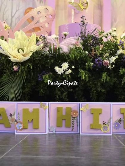 Personalized name blocks are one of my favorite details. For Samhita's party, I decorated each letter with intricate floral and butterfly elements to perfectly match the enchanted theme.
