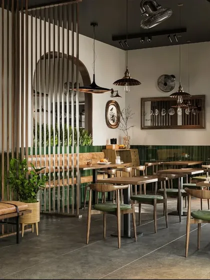 For this restaurant, we designed an atmosphere that feels both modern and comfortable. The space uses natural wood tones, vertical slat partitions to create intimacy, and industrial-style lighting to establish a warm and inviting dining experience.