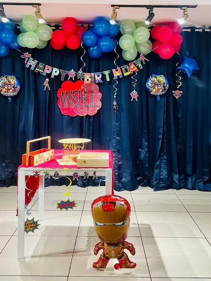 An action-packed Avengers and Marvel themed birthday decor setup, perfect for a little superhero's celebration.