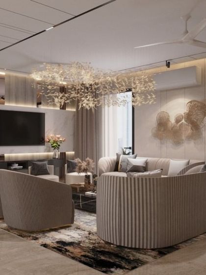 This living room in Lucknow showcases our use of curved furniture and layered lighting to create a soft and inviting atmosphere. The unique chandelier acts as a centerpiece, complemented by a mix of textures and a neutral color palette for a high-end, modern feel.