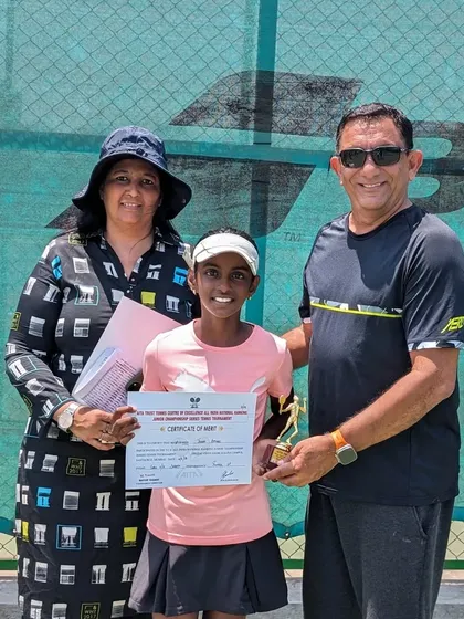 Trisha with her family and her certificate of merit at the Kalina Championship Series.