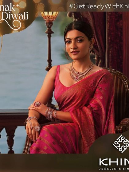 A regal and elegant portrait of Prakruti Mishra for Khimji Jewellers. The makeup is sophisticated and clean, with a focus on enhancing her features to complement the beautiful pink saree and diamond necklace.