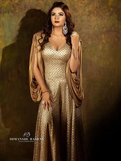 This is from a professional photoshoot, showing a full glam, high fashion makeup look. I focused on creating a sculpted, bronzed base and a bold lip to match the dramatic gold gown.