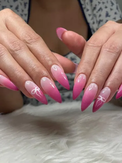All things pink! A sharp stiletto set with a pink ombré effect and cute white bow details.