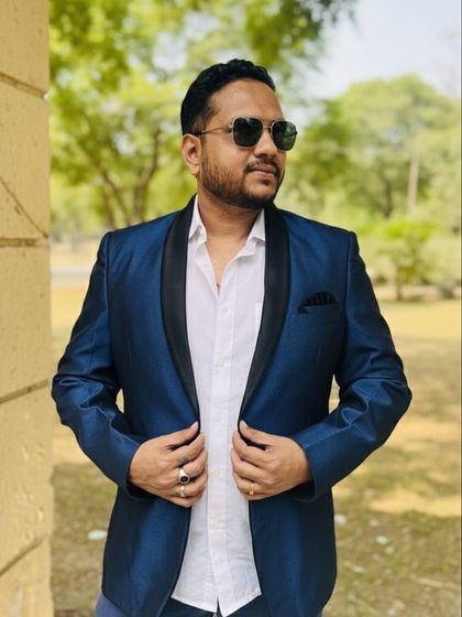This shiny blue blazer with a black satin lapel is a real showstopper. It's a great rental option for cocktail parties, sangeet nights, or any event where you want to make a statement.