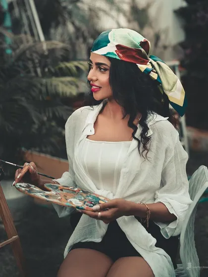 A conceptual portrait that brings an artistic idea to life. Here, the theme of 'the artist' is explored, using props and a specific color grade to build a narrative and create a unique, story-driven image.