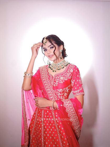 This pose highlights the maang tikka and detailed neckline. We ensure every element is perfect for your MUA portfolio shoot.