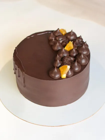 For those who like a little kick, I offer this Orange Rum cake. It features a rum-infused chocolate sponge with a zesty orange ganache, decorated with candied orange slices.
