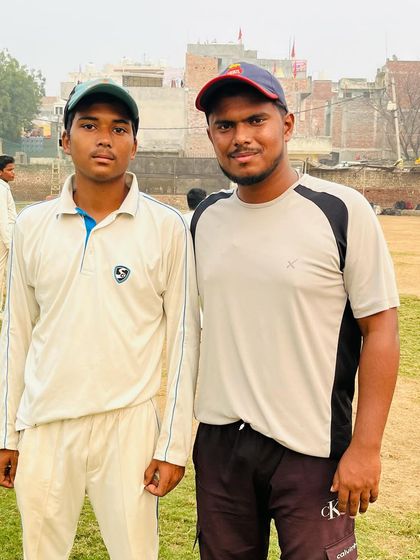 Sahil Jangra with his coach after his century.