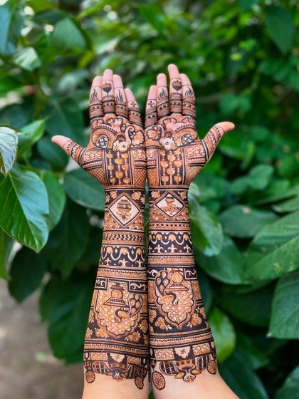 A beautiful shot of a customized Extravaganza design, featuring elegant peacocks and traditional Indian motifs against a backdrop of lush greenery.