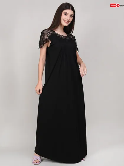 A three-quarter view of the nightgown, showing the garment's flow and the delicate lace shoulder details from a different angle.