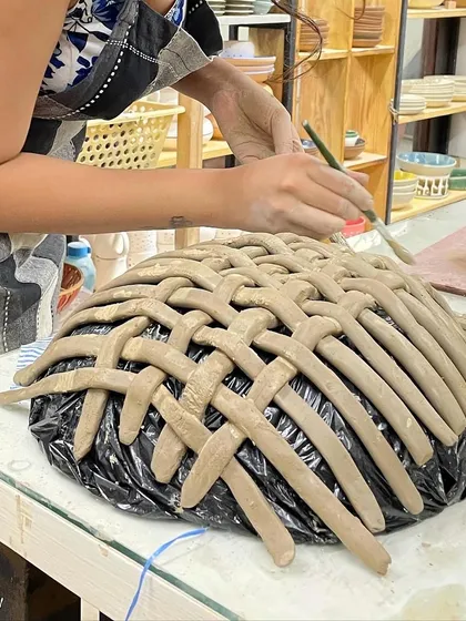 This woven bowl is a fantastic example of advanced slab work. Strips of clay are interlaced to create a stunning, basket-like effect.