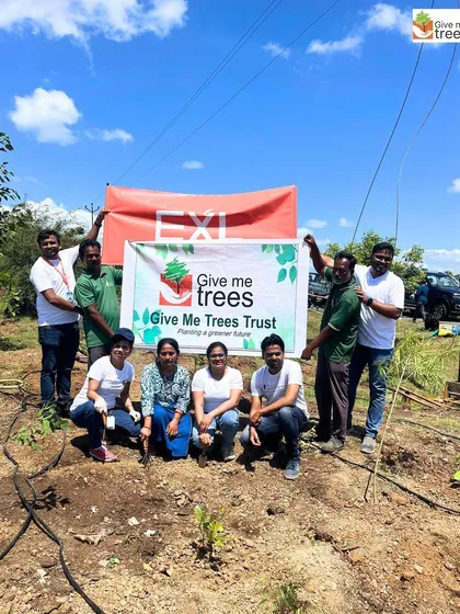 The core team from EXL celebrating a successful plantation drive in Wadegaon. Their support was instrumental in planting 600 new trees.