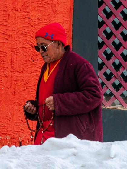 A portrait of a monk in Spiti, adding a human and cultural element to the landscape series.