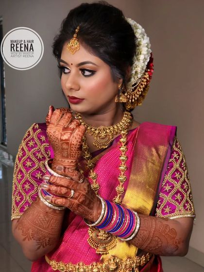 A powerful and elegant pose. The intricate henna design and the stunning jewellery complete her bridal transformation.