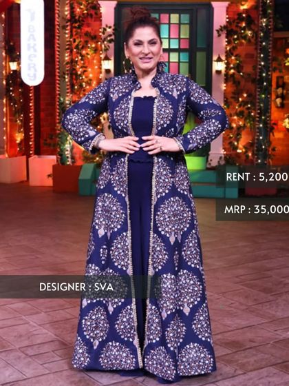 The ever-graceful Archana Puran Singh in a royal blue jacket set by designer SVA. This outfit, seen on television, features intricate silver embroidery and offers a regal look for any formal occasion.