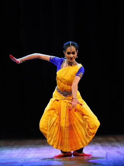 A moment from my performance of 'Maam Pahi' on stage. As a performer, I bring my passion and experience into every class, sharing the depth and dynamism of Bharatanatyam with my students.